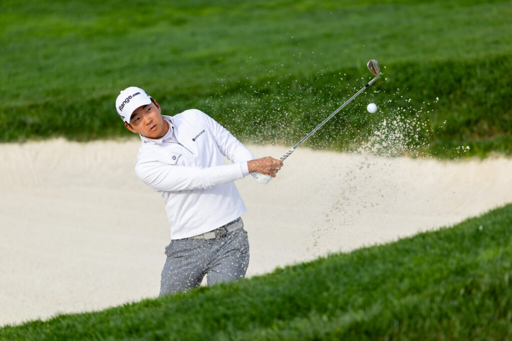 Michael Kim of the United States hits a banker shot on the first hole during the third round of the AT&T Pebble Beach Pro-Am 2026