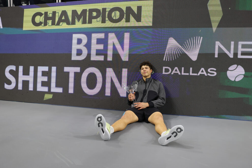 Ben Shelton poses with the Dallas Open trophy after beating Taylor Fritz in the 2026 final.