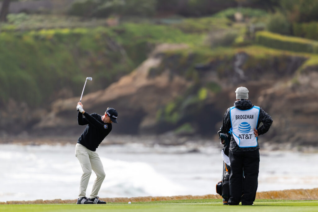 Jacob Bridgeman of the United States hits a shot on the 18th hole during the final round of the AT&T Pebble Beach Pro-Am 2026