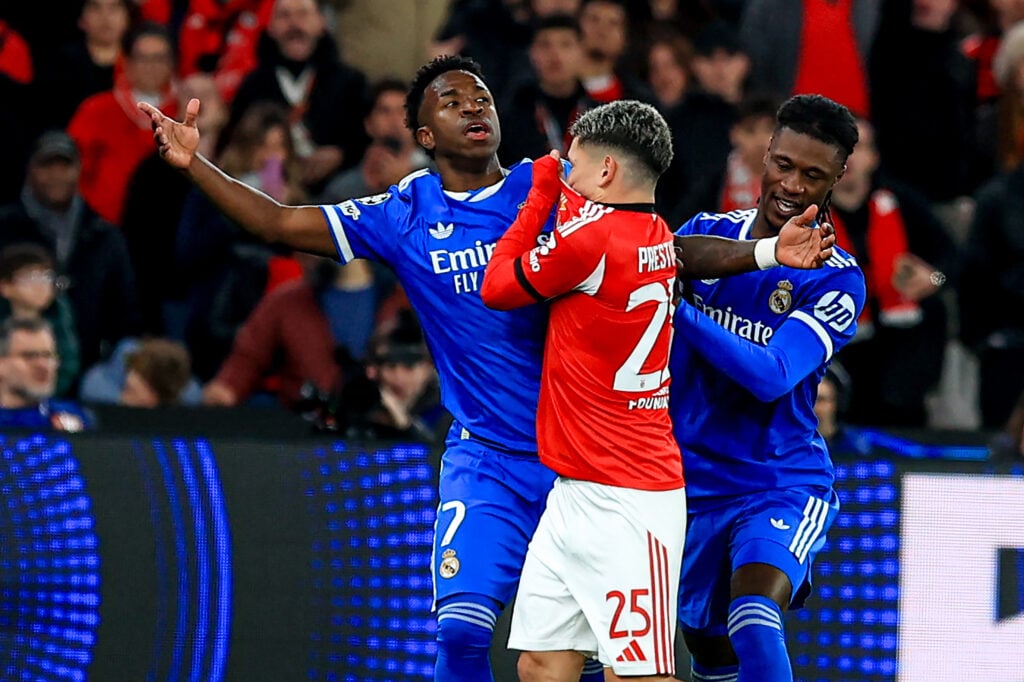 Vinícius Júnior of Real Madrid CF and Gianluca Prestianni of SL Benfica argue during the UEFA Champions League 2025/26 League Knockout Play-off First Leg match between SL Benfica and Real Madrid C.F. at Estadio do SL Benfica on February 17, 2026.