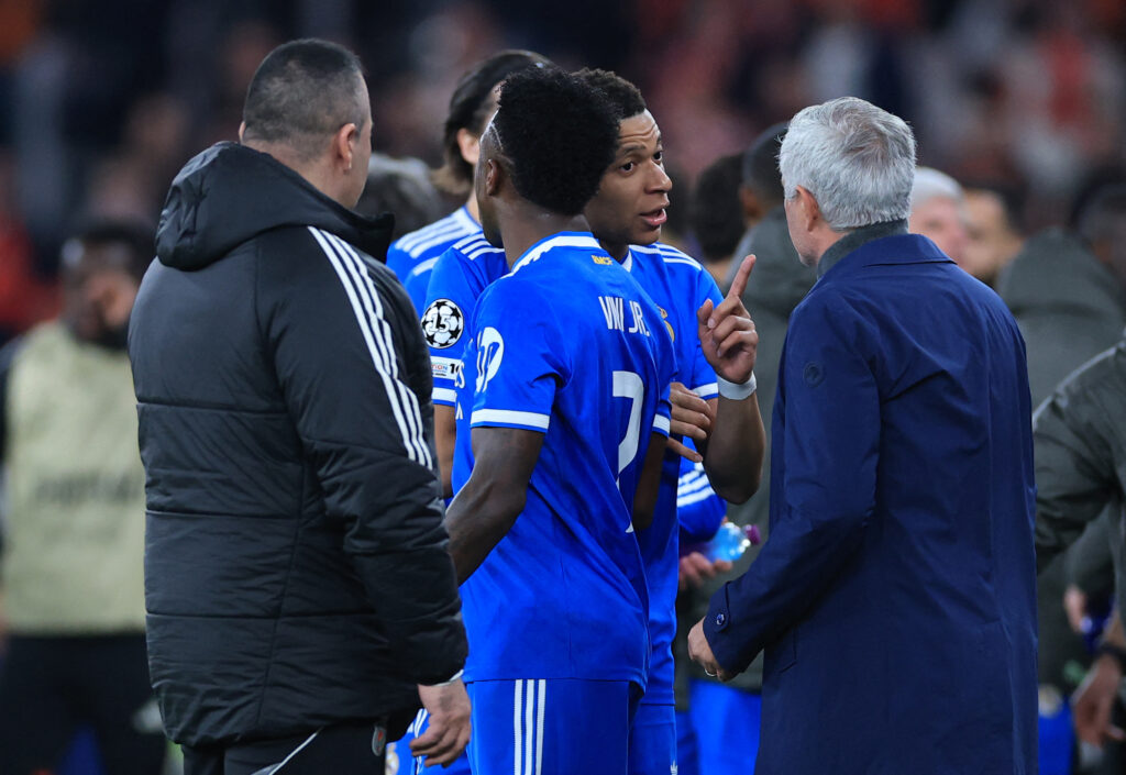 Real Madrid's French forward #10 Kylian Mbappe talks with SL Benfica's Portuguese head coach Jose Mourinho after Real Madrid's Brazilian forward #07 Vinicius Junior (back) listened racists insults.
