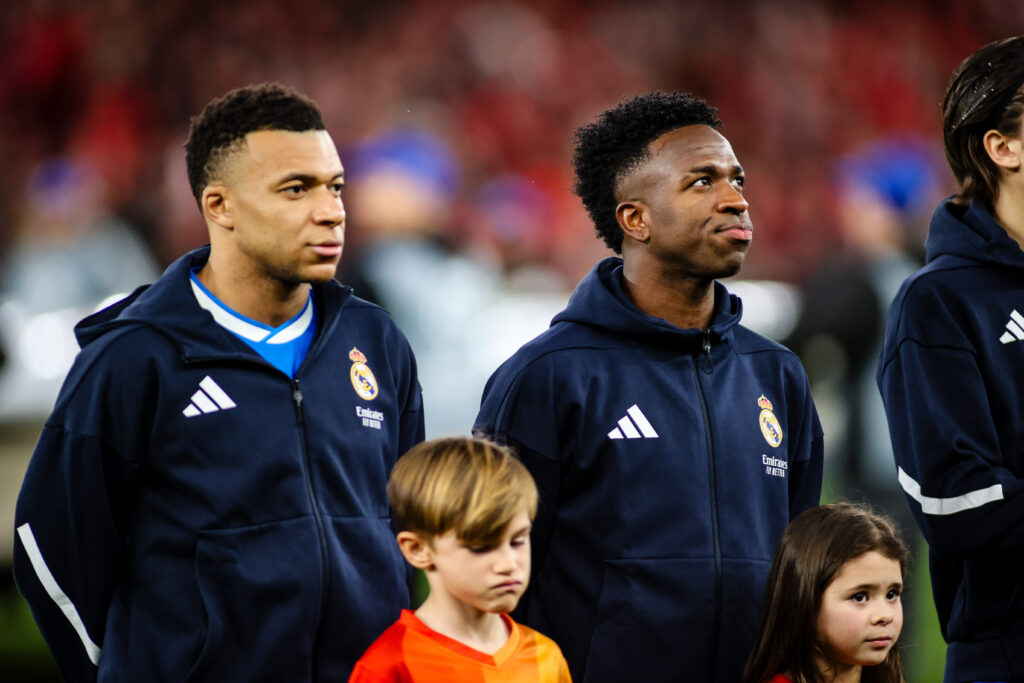 Real Madrid's Kylian Mbappé and Real Madrid's Vinicius Junior during the UEFA Champions League 2025/26 League Knockout Play-off First Leg match between SL Benfica and Real Madrid C.F. at Estadio do SL Benfica.