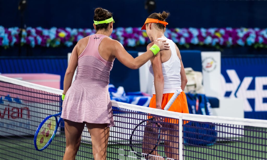 Belinda Bencic of Switzerland and Elina Svitolina of Ukraine shake hands at the net after the third round on Day Four of the Dubai Duty Free Tennis Championships, part of the Hologic WTA Tour at Dubai Duty Free Tennis Stadium on February 18, 2026 in Dubai, United Arab Emirates.