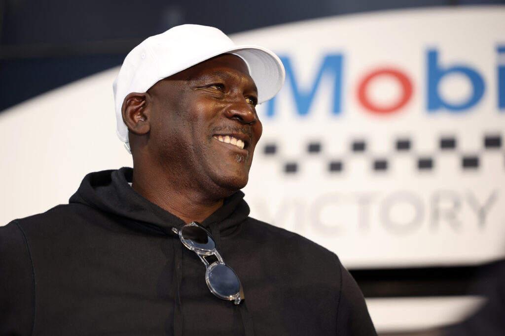 Michael Jordan, NBA Hall of Famer and co-owner of 23XI Racing celebrates in victory lane after Tyler Reddick, driver of the #45 Chumba Casino Toyota, wins the NASCAR Cup Series Daytona 500 at Daytona International Speedway.