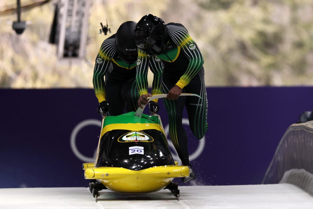 Shane Pitter and Junior Harris of Team Jamaica compete in the Men's Two-Man Bobsleigh Heat 1 on day ten of the Milano Cortina 2026 Winter Olympic games at Cortina Sliding Centre