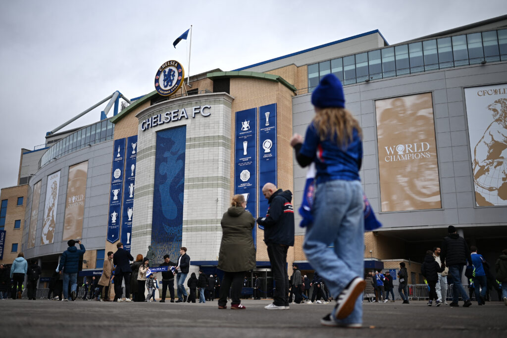 Supporters arrive at the stadium for the English Premier League football match between Chelsea and Burnley at Stamford Bridge