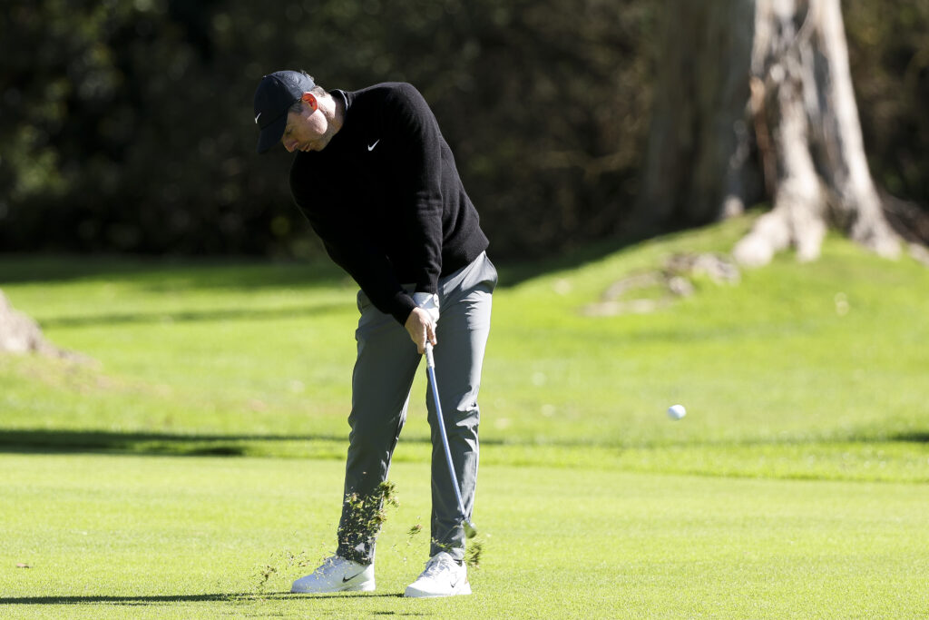 Rory McIlroy of Northern Ireland hits an approach shot on the 13th hole prior to The Genesis Invitational 2026 at Riviera Country Club