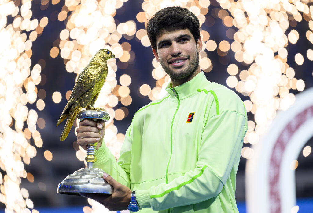 Carlos Alcaraz poses with the trophy after winning the 2026 Qatar Open.