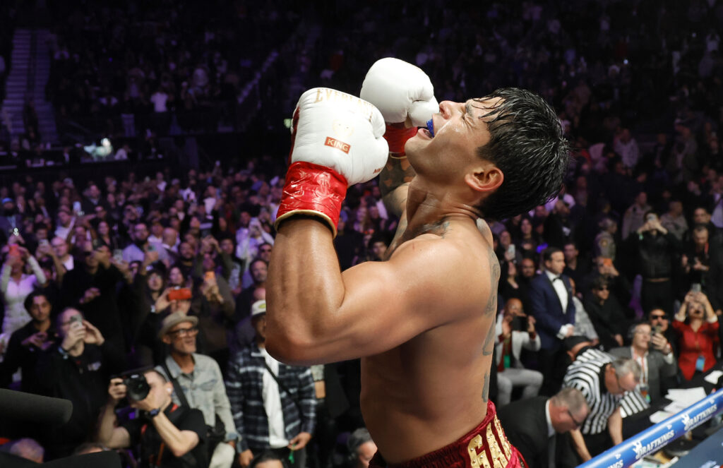 Ryan Garcia celebrates after going 12 rounds against WBC welterweight champion Mario Barrios in a title fight at T-Mobile Arena.
