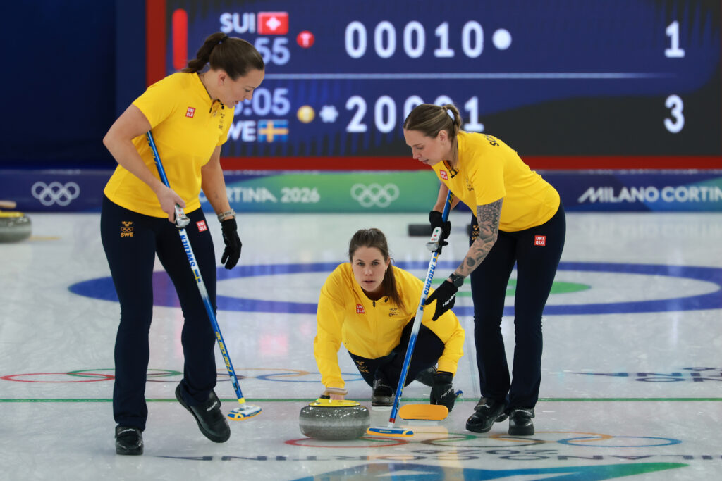 Agnes Knochenhauer, Anna Hasselborg and Sofia Scharback of Team Sweden compete during the Women's Gold Medal match between Team Switzerland and Team Sweden on day sixteen of the Milano Cortina 2026 Winter Olympic games at Cortina Curling Olympic Stadium on February 22, 2026 in Cortina d'Ampezzo, Italy