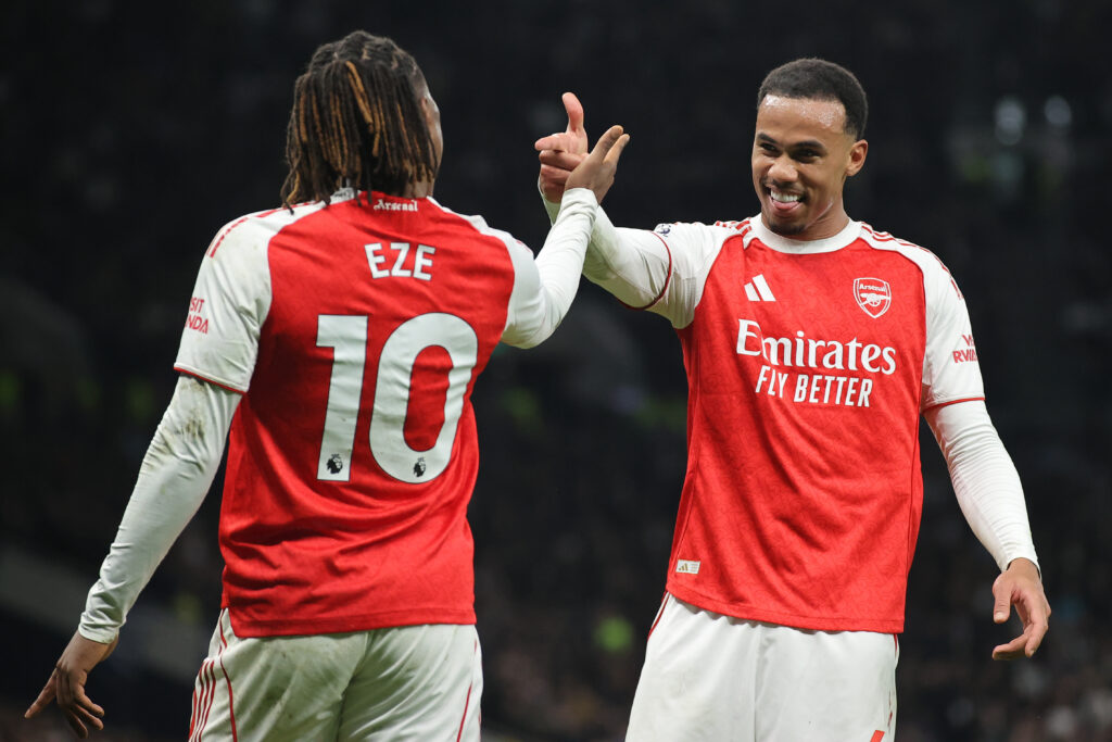 Eberechi Eze of Arsenal celebrates after scoring their side's third goal with teammate Gabriel Magalhaes during the Premier League match