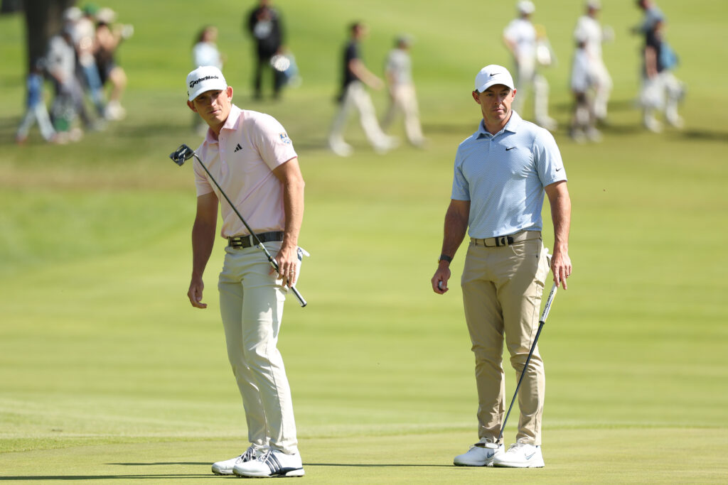 Jacob Bridgeman and Rory McIlroy prepare to putt on the second green during the final round of The Genesis Invitational 2026 at Riviera Country Club