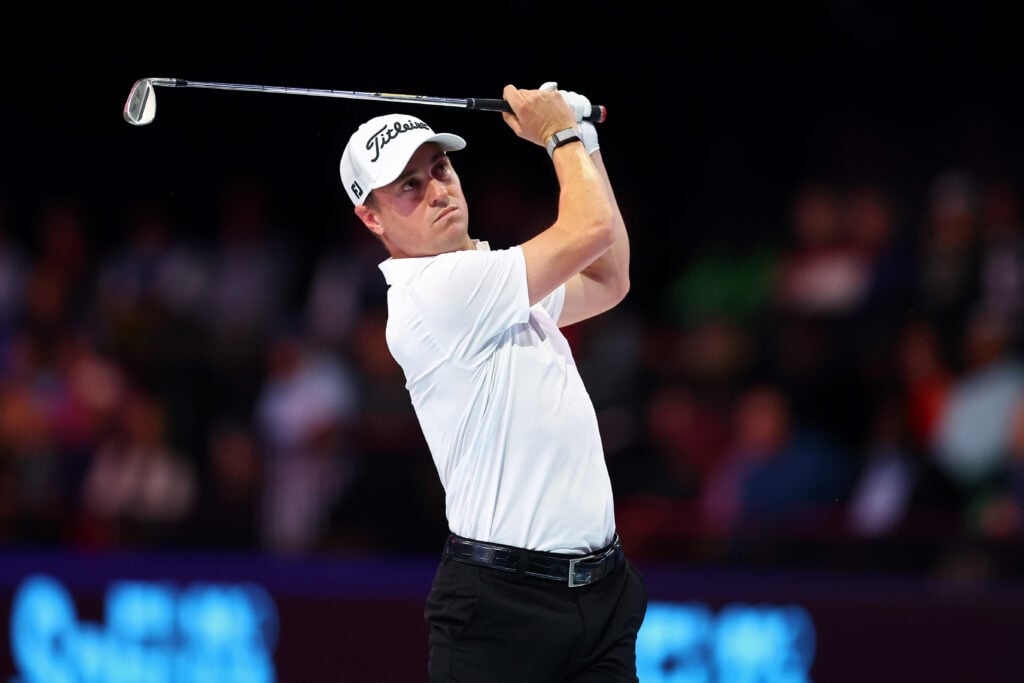 Justin Thomas of Atlanta Drive GC plays a shot on the first hole during the match against Boston Common Golf at SoFi Center