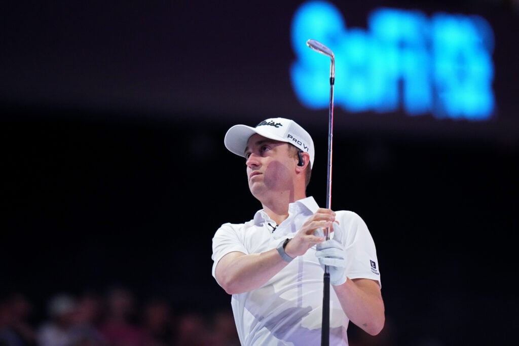 Justin Thomas of Atlanta Drive GC plays a shot on the first hole during the match against Boston Common Golf at SoFi Center