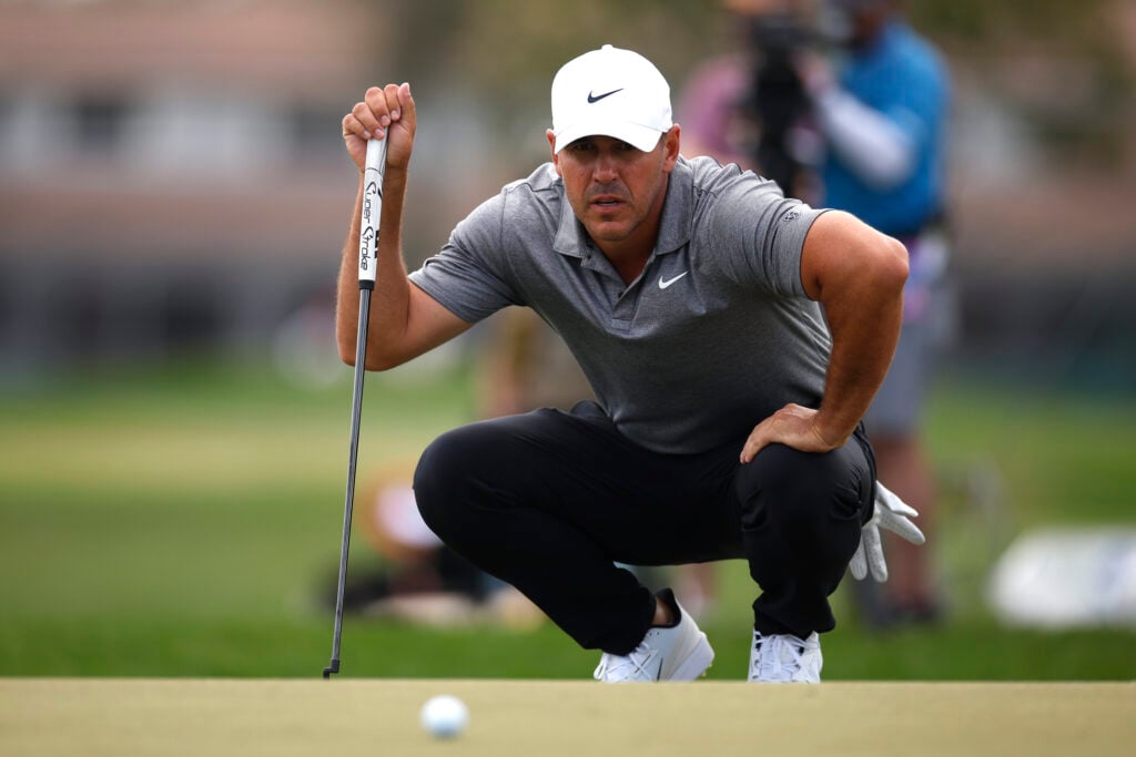Brooks Koepka of the United States lines up a putt on the fourth green during the first round of the Cognizant Classic 2026