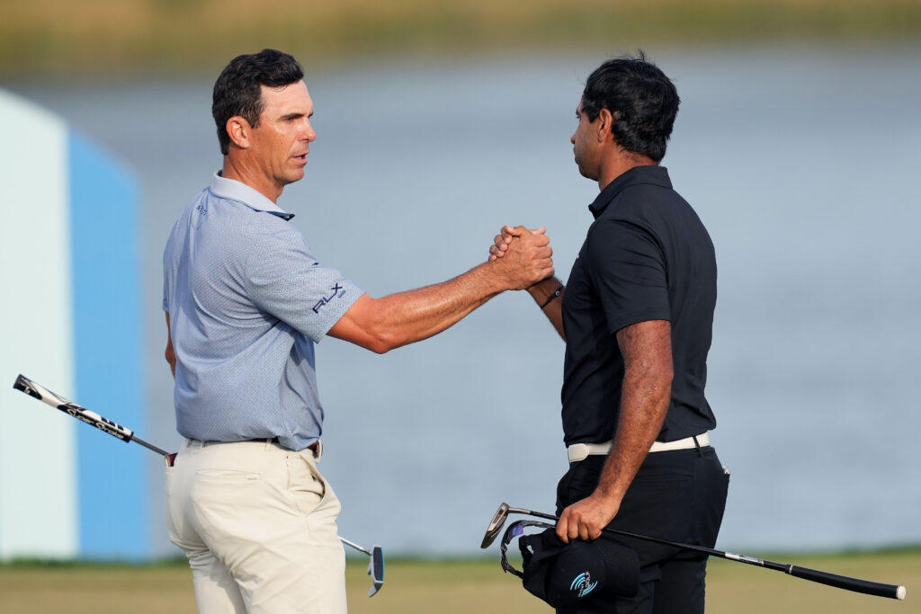 Billy Horschel of the United States and Aaron Rai of England shake hands on the 18th green during the second round of the Cognizant Classic 2026 at PGA National