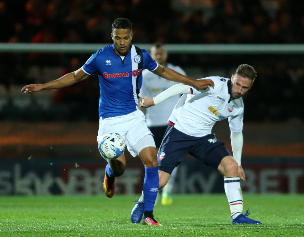 Rochdale's Joe Thompson battles with Bolton Wanderers' James Henry during the Sky Bet League One match between Rochdale and Bolton Wanderers at Spotland Stadium.