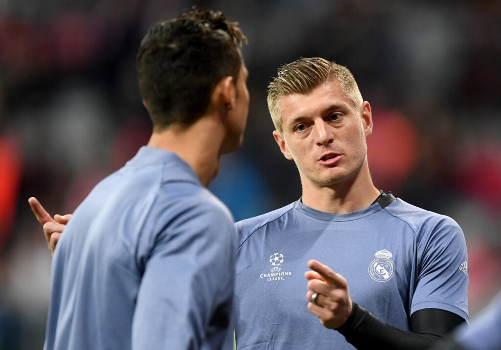 Toni Kroos of Real Madrid talks to his team mate Cristiano Ronaldo talk prior to the UEFA Champions League Quarter Final first leg match between FC Bayern Muenchen and Real Madrid CF at Allianz Arena.
