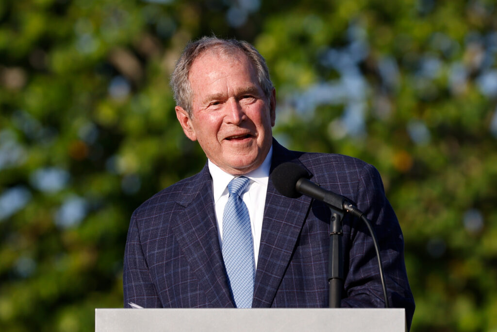 Former U.S. President George W. Bush speaks during the flag raising ceremony prior to The Walker Cup at Seminole Golf Club