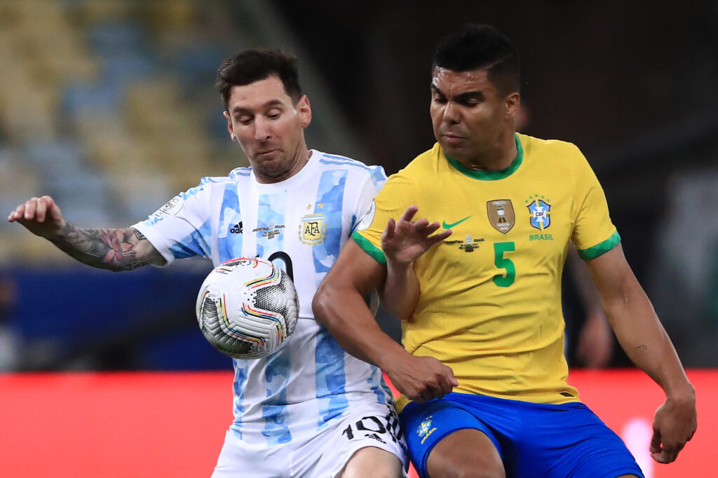 Lionel Messi of Argentina fights for the ball with Casemiro of Brazil during the final of Copa America Brazil 2021 between Brazil and Argentina at Maracana Stadium.