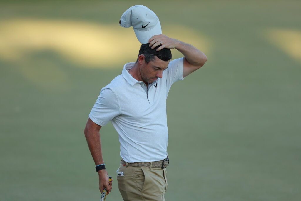 Rory McIlroy of Northern Ireland reacts to his missed up on the 18th green during the third round of the Arnold Palmer Invitational