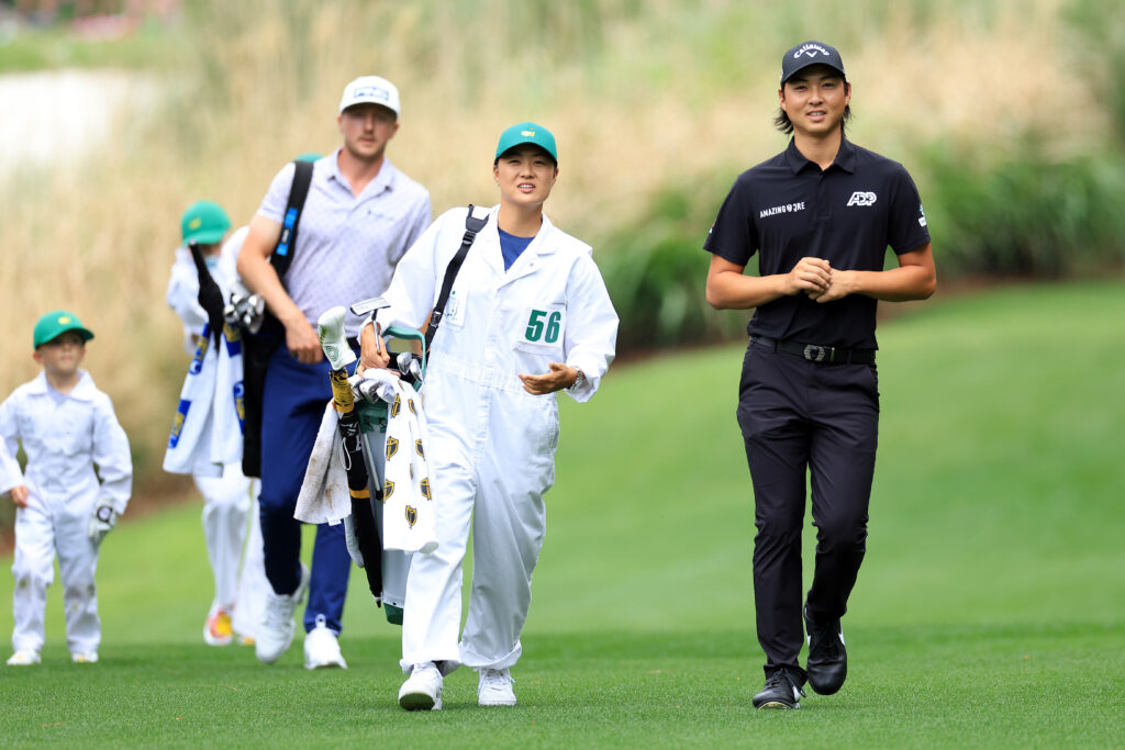Min Woo Lee of Australia and sister LPGA player Minjee Lee during the Par Three Contest prior to the Masters at Augusta National Golf Club on April 06, 2022
