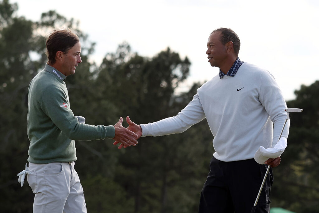 Kevin Kisner and Tiger Woods shake hands after the third round of the 2022 Masters