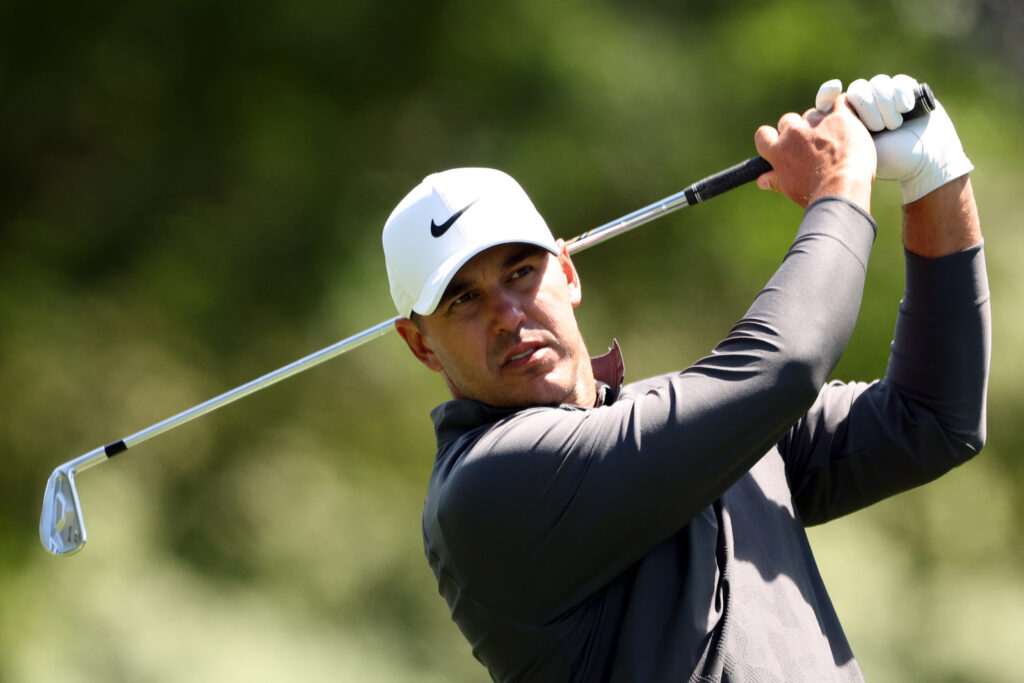Brooks Koepka hits his approach during the final round of the 2023 Masters