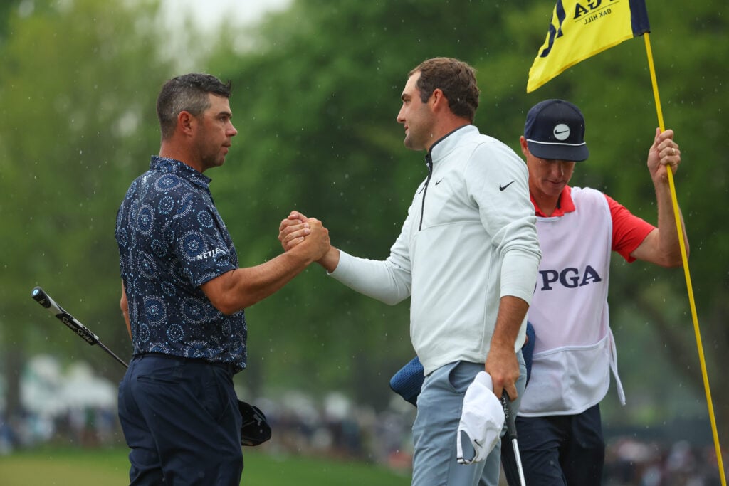 Gary Woodland shakes hands with Scottie Scheffler on day two of the PGA Championship at Oak Hill