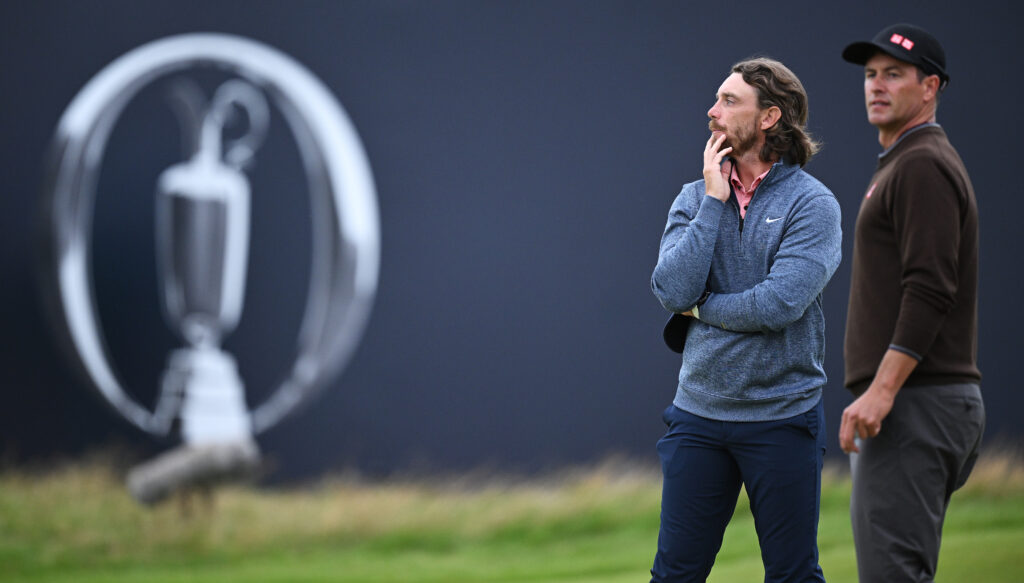 Tommy Fleetwood of England alongside Adam Scott during Day Two of The Open at Royal Liverpool