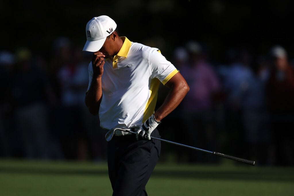 Tiger Woods reacts to finding the water on the 15th hole during the second round of the 2013 Masters