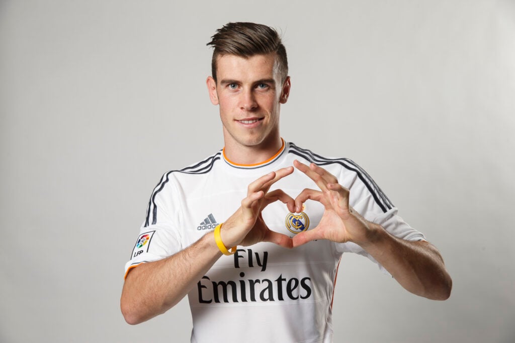 Gareth Bale poses during his official presentation as a new Real Madrid player at Estadio Santiago Bernabeu.