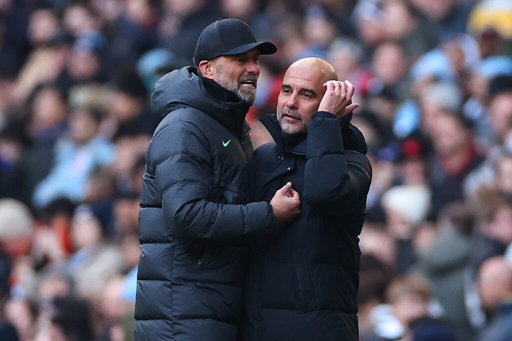 Jurgen Klopp the head coach / manager of Liverpool and Pep Guardiola the head coach / manager of Manchester City reacts at full time during the Premier League match between Manchester City and Liverpool FC at Etihad Stadium.