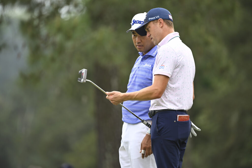 Justin Thomas and Hideki Matsuyama on the first green during the first round of Masters at Augusta National