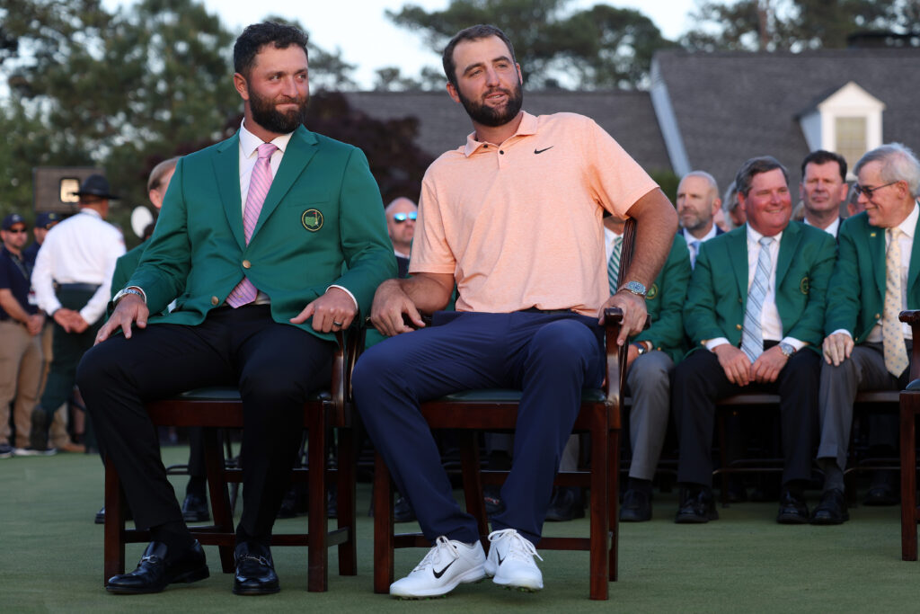 Jon Rahm of Spain (L) and Scottie Scheffler of the United States attend the Green Jacket Ceremony after Scheffler won the 2024 Masters Tournament