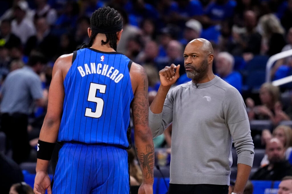 Orlando Magic head coach Jamahl Mosley speaks to Paolo Banchero #5 of the Orlando Magic during a game against the Cleveland Cavaliers in game three of the Eastern Conference First Round Playoffs at Kia Center on April 25, 2024 in Orlando, Florida.
