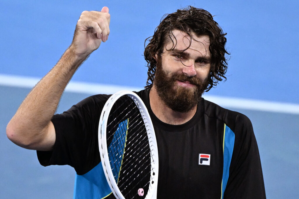 USA's Reilly Opelka celebrates defeating Serbia's Novak Djokovic in their men's singles quarter-final match at the Brisbane International tennis tournament in Brisbane on January 3, 2025.