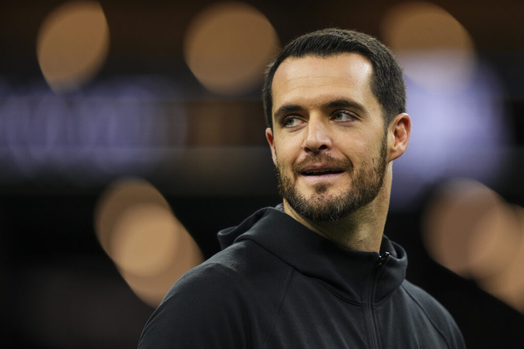 Derek Carr #4 of the New Orleans Saints looks on from the field during warmups prior to an NFL football game against the Las Vegas Raiders at Caesars Superdome.