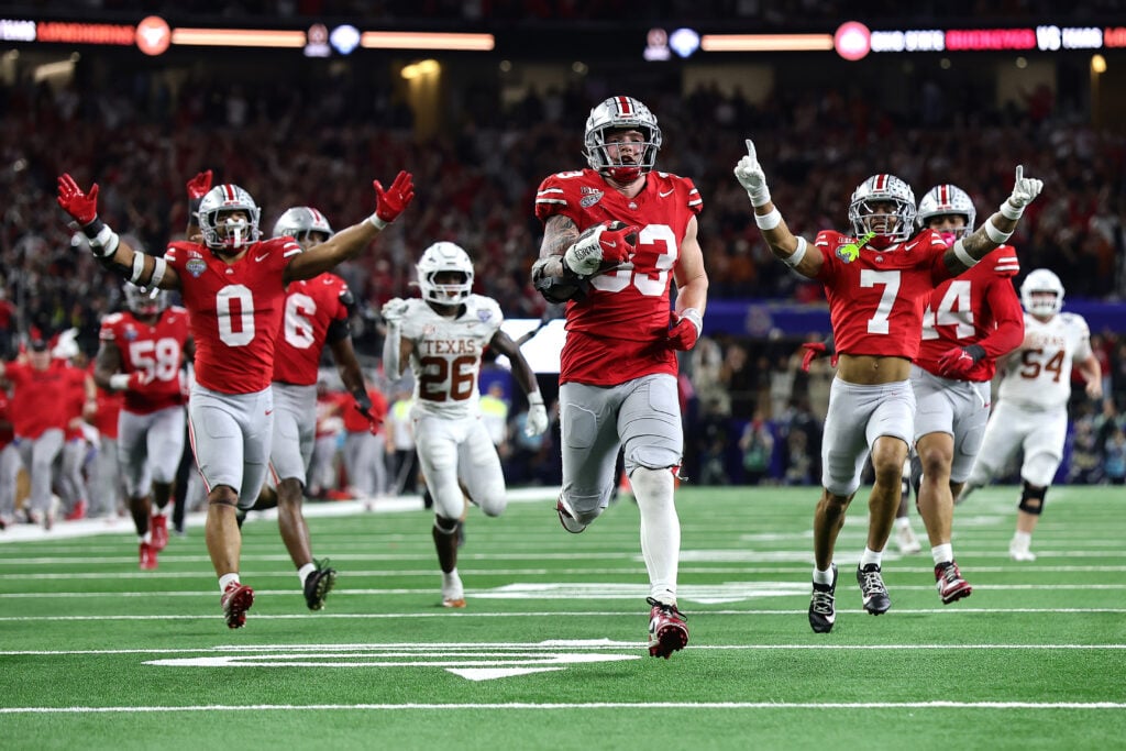 Jack Sawyer #33 of the Ohio State Buckeyes runs with the ball after recovering a fumble in the fourth quarter against the Texas Longhorns during the Goodyear Cotton Bowl at AT&T Stadium on January 10, 2025 in Arlington, Texas.