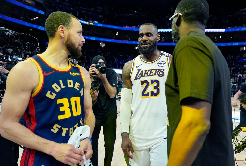 LeBron James #23 of the Los Angeles Lakers talks with Draymond Green #23 and Stephen Curry #30 of the Golden State Warriors after the Lakers defeated the Warriors 118-108 at Chase Center on January 25, 2025 in San Francisco, California.