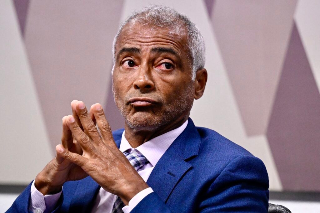 Brazilian senator and former soccer player Romario gestures during the reading of the final report on the manipulation of games for betting purposes in Brasilia.