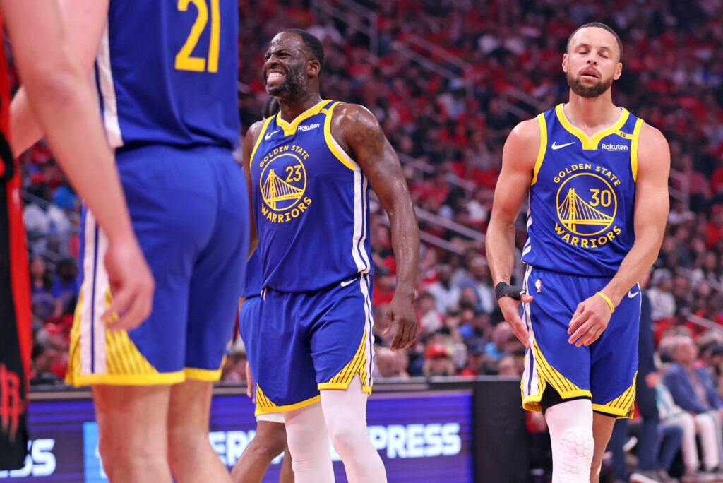 Golden State Warriors' Draymond Green and Stephen Curry react to a missed free throw by Green in 1st quarter against Houston Rockets in Game 2 of First Round of NBA Playoffs at Toyota Center in Houston, Texas on Wednesday, April 23, 2025.
