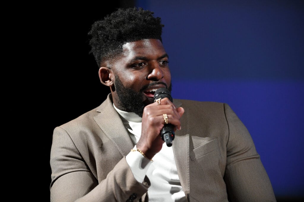 Emmanuel Acho speaks onstage during "The Children of October 7" LA Screening at Paramount Studios, Sherry Lansing Theatre.