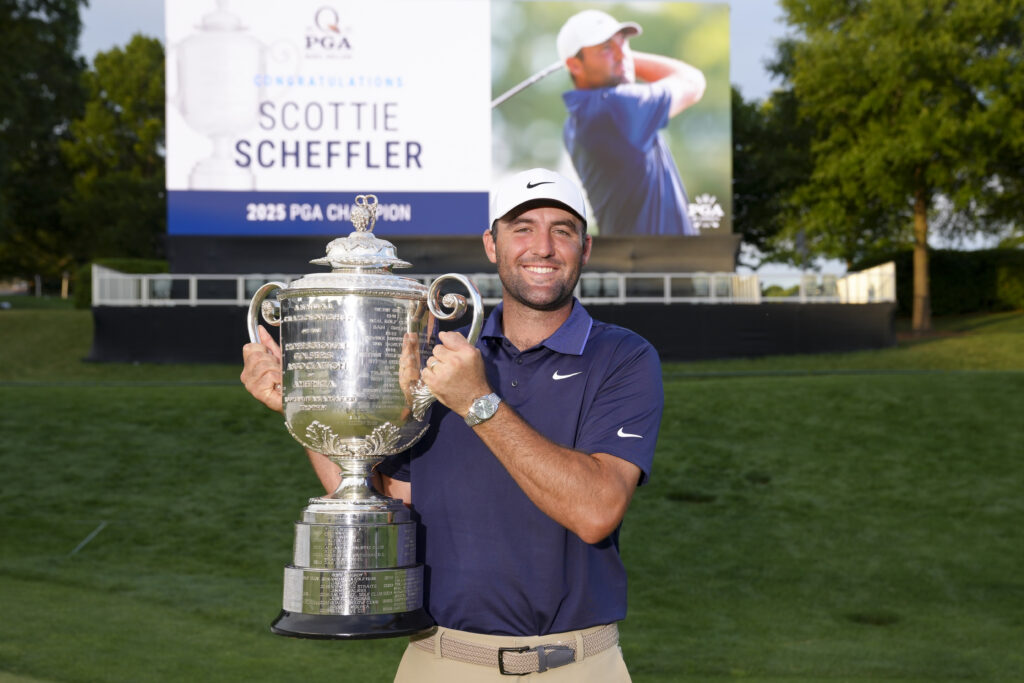 Scottie Scheffler lifts the trophy after winning the 2025 PGA Championship