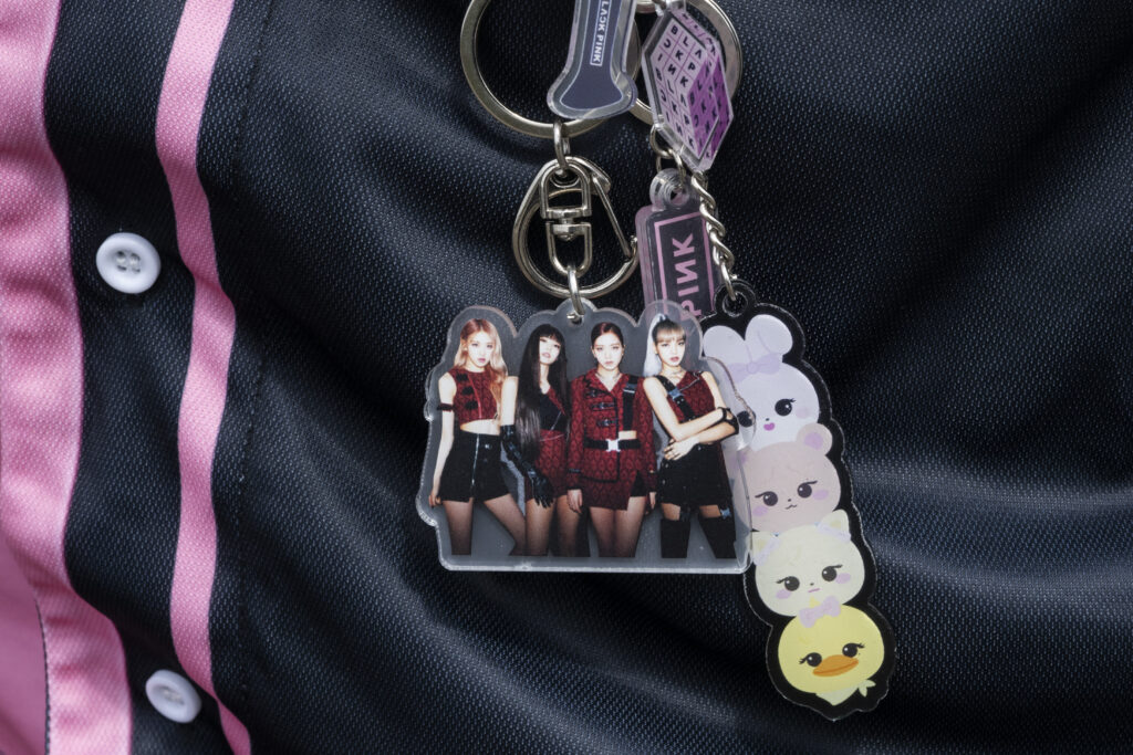 This photograph shows an offical Blackpink keyring representing the four singers of the group outside the Stade de France stadium prior to the concert of South-Korean K-Pop group Blackpink in Saint-Denis, in the northern outskirts of Paris, on August 2, 2025.