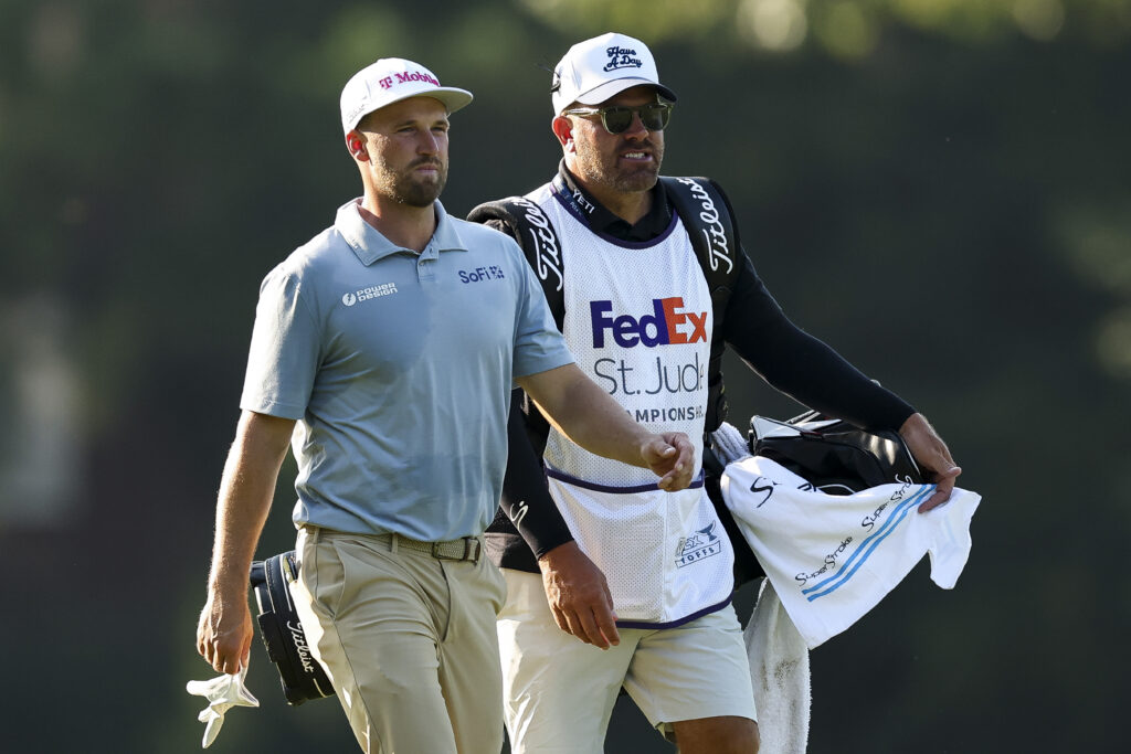 Wyndham Clark and his caddie John Ellis walk the second hole during the first round of the FedEx St. Jude Championship 2025