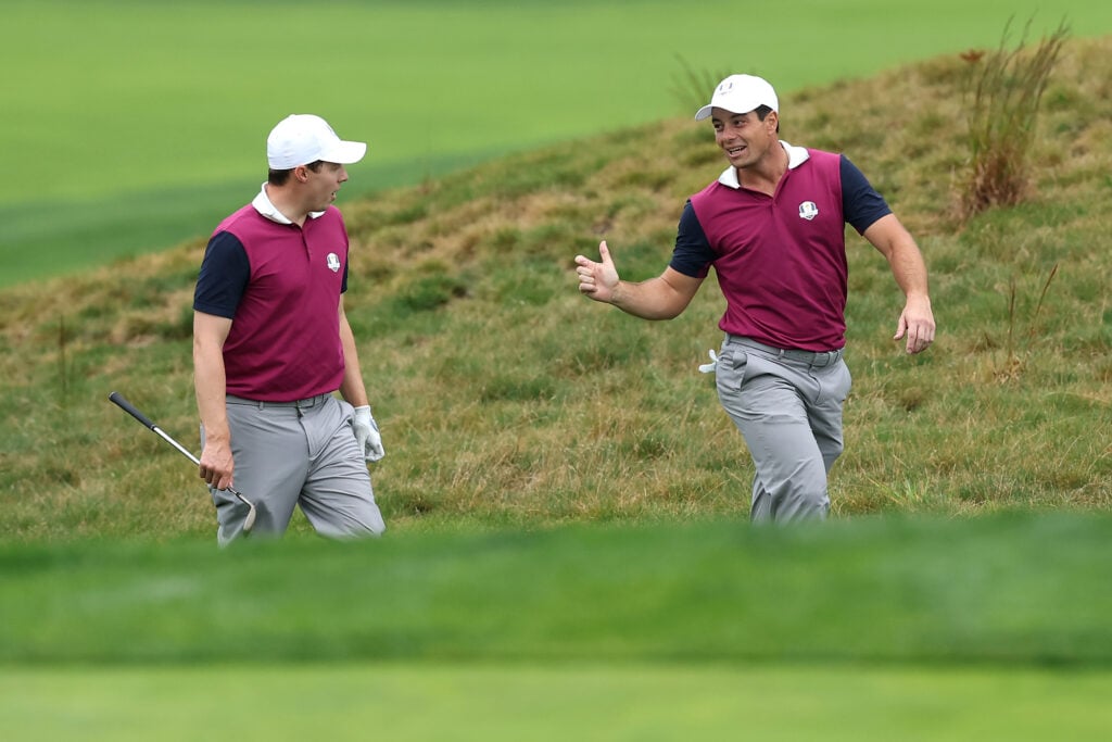 Viktor Hovland and Matt Fitzpatrick talk during a practice round ahead of the 2025 Ryder Cup