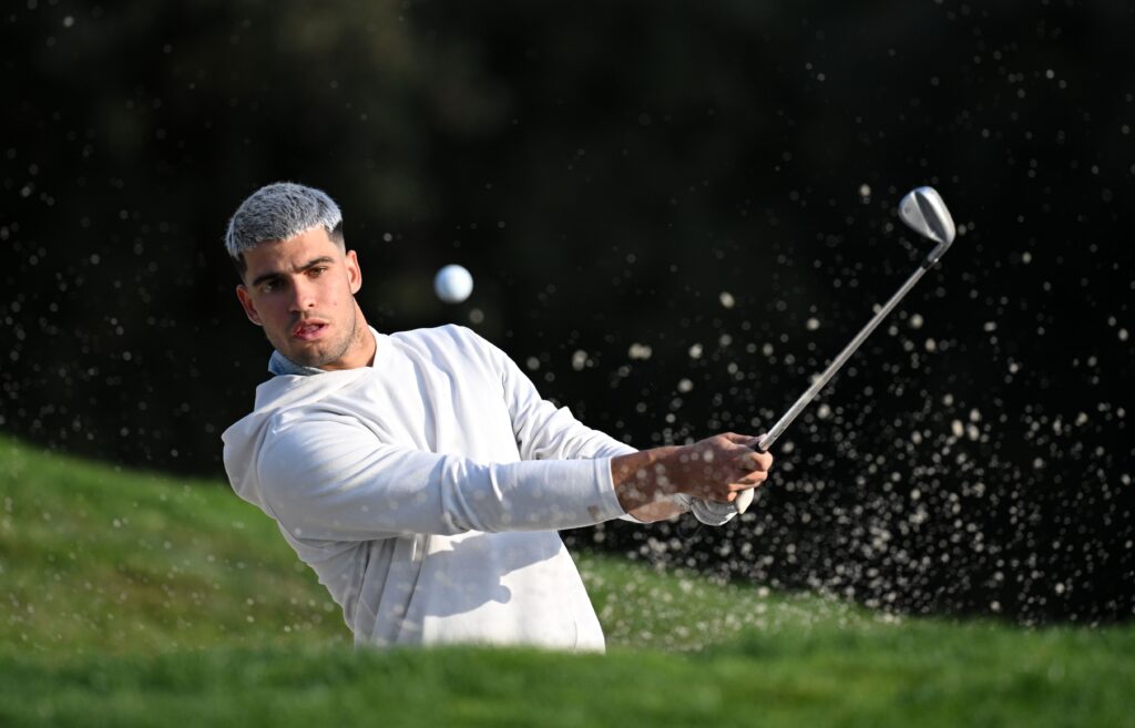 World Number one tennis player Carlos Alcaraz of Spain plays a shot during the pro-am prior to the Open de España presented by Madrid 2025