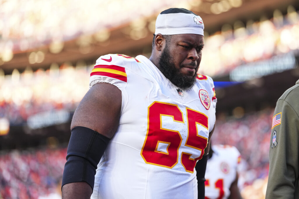 Trey Smith #65 of the Kansas City Chiefs exits the field at halftime during an NFL football game against the Denver Broncos at Empower Field at Mile High.