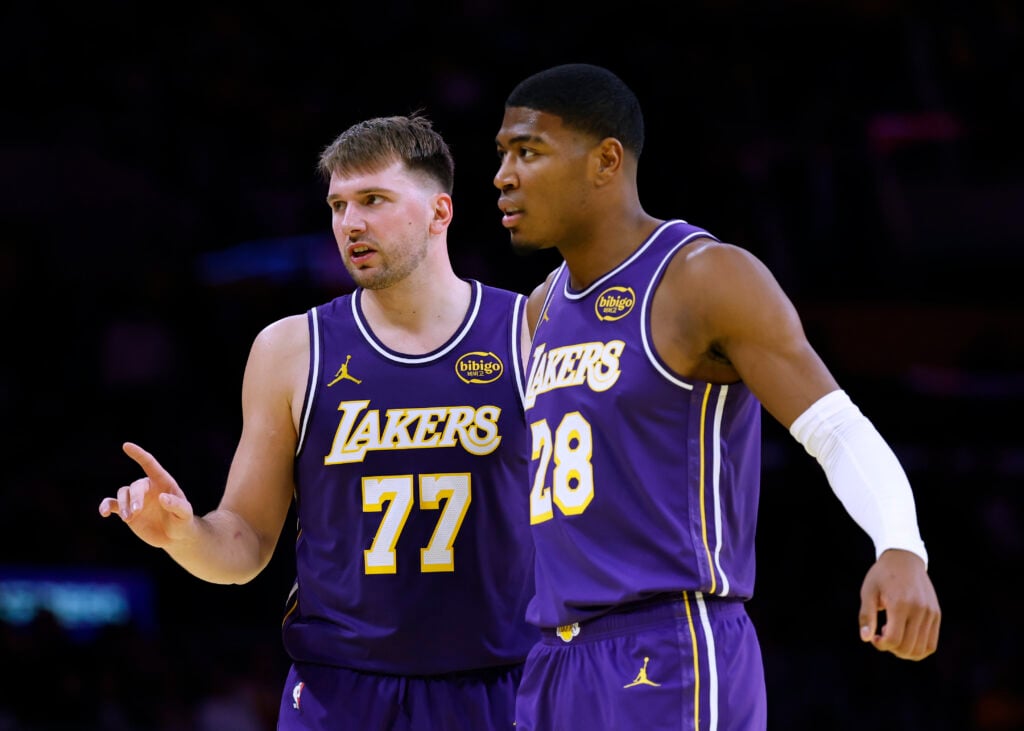 Luka Doncic #77 and Rui Hachimura #28 of the Los Angeles Lakers react during a 135-118 Lakers win over the LA Clippers at Crypto.com Arena on November 25, 2025 in Los Angeles, California.